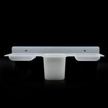 Plastic soap dish and tray with functional design for efficient soap storage.