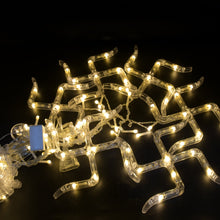 Detailed view of the decorative string lights with hanging props for festive decoration.